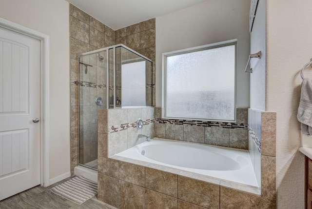 bathroom with vanity, plus walk in shower, and wood-type flooring