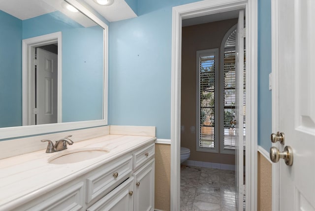 bathroom with vanity and toilet