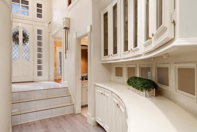 foyer entrance with light wood-type flooring