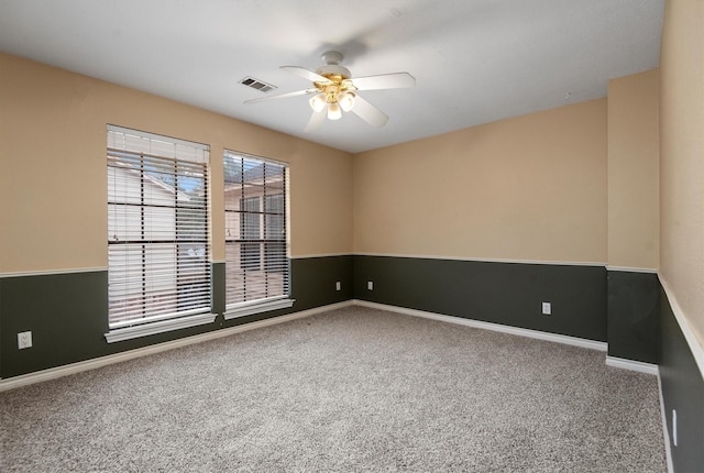 carpeted empty room with ceiling fan