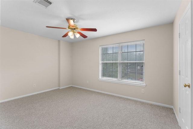 unfurnished room with ceiling fan and carpet flooring