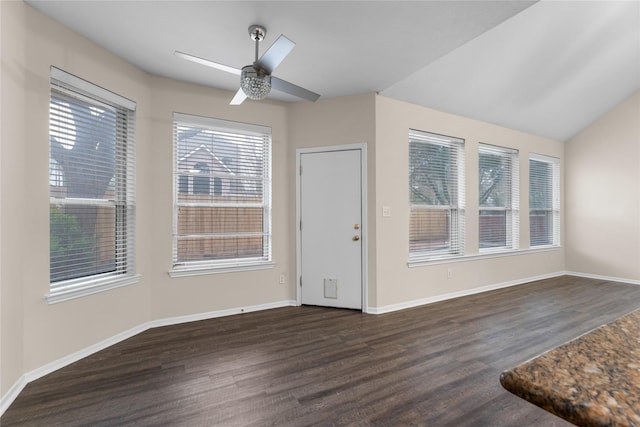 foyer entrance with ceiling fan, vaulted ceiling, and dark hardwood / wood-style flooring