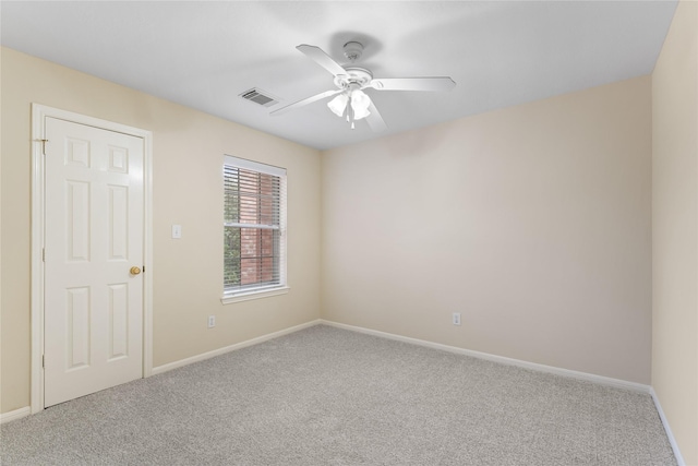 carpeted empty room with ceiling fan