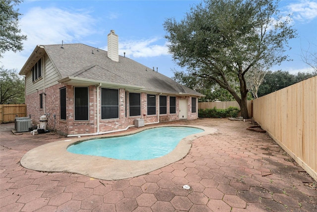 view of pool featuring central AC and a patio