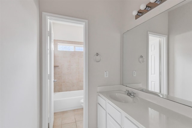 full bathroom featuring toilet, vanity, and tile patterned floors