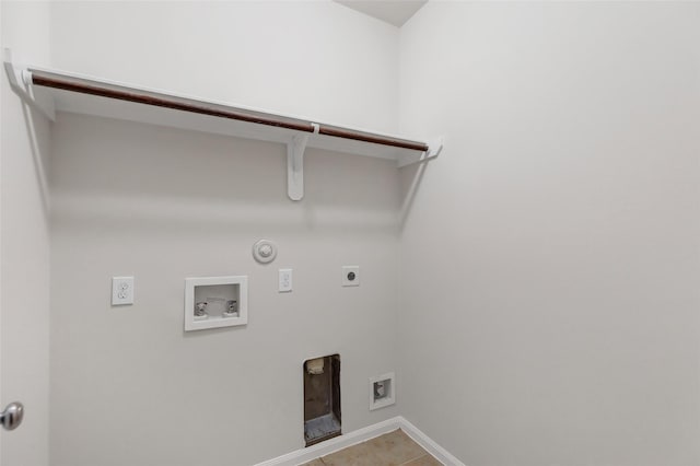 clothes washing area featuring hookup for a washing machine, hookup for a gas dryer, hookup for an electric dryer, laundry area, and baseboards