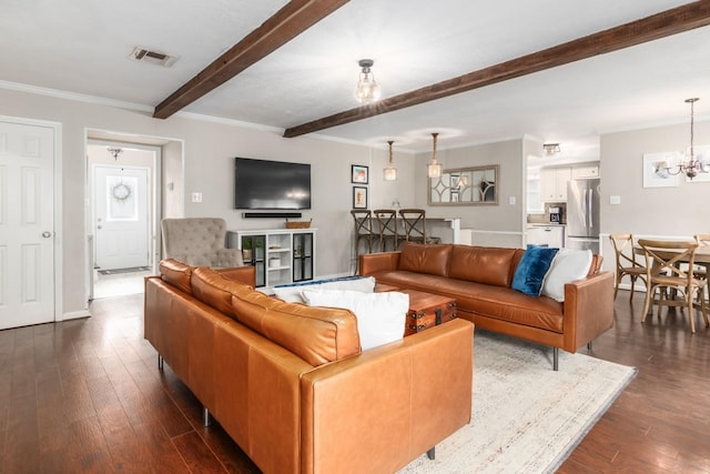 living room featuring an inviting chandelier, ornamental molding, dark hardwood / wood-style floors, and beam ceiling