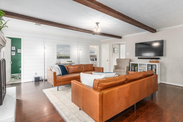 living room with dark hardwood / wood-style floors, a fireplace, and beamed ceiling