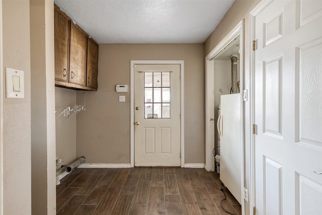 washroom with dark hardwood / wood-style floors and a textured ceiling