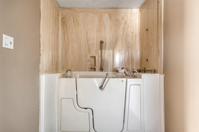 bathroom featuring a textured ceiling