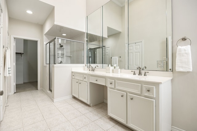 bathroom with vanity, tile patterned flooring, and a shower with shower door