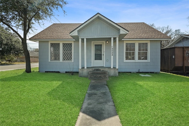 bungalow-style house with a front yard