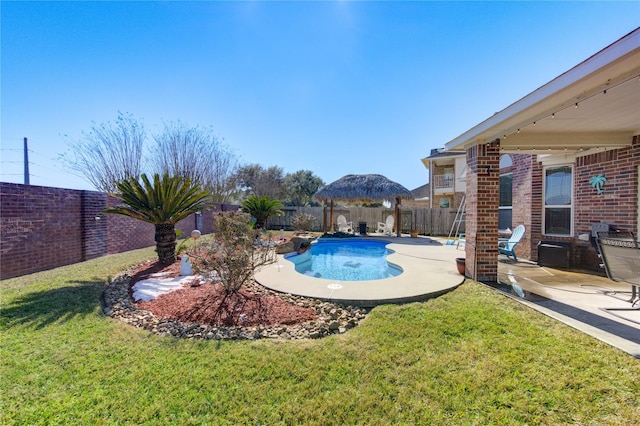 view of pool featuring a patio, a gazebo, and a lawn