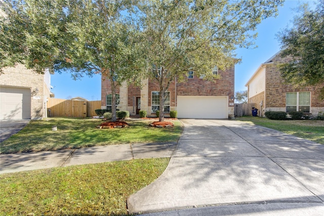 view of front of property featuring a garage and a front lawn