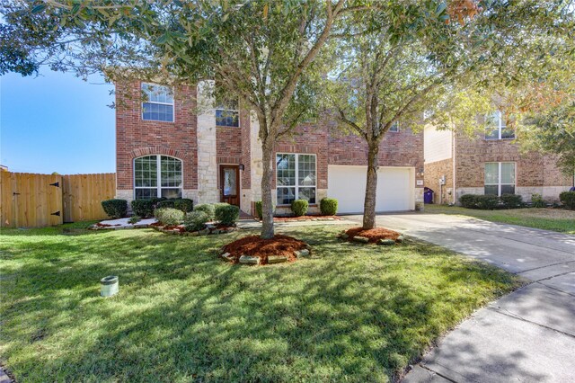 view of front of home with a garage and a front yard