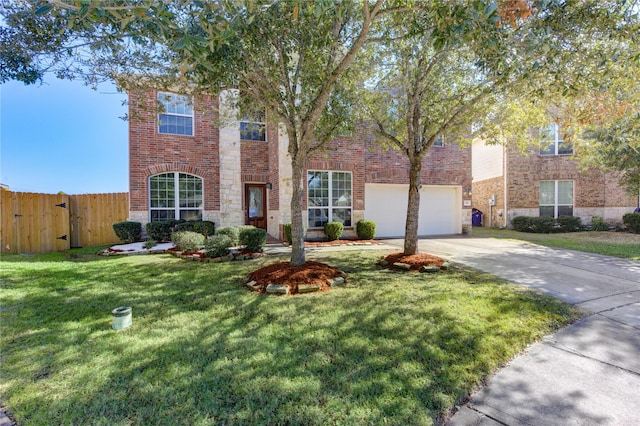 view of front of house featuring brick siding, concrete driveway, fence, a garage, and a front lawn