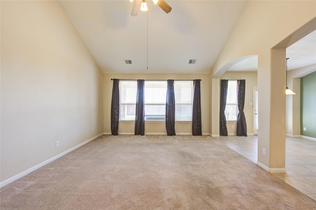 unfurnished room featuring ceiling fan, light carpet, and high vaulted ceiling