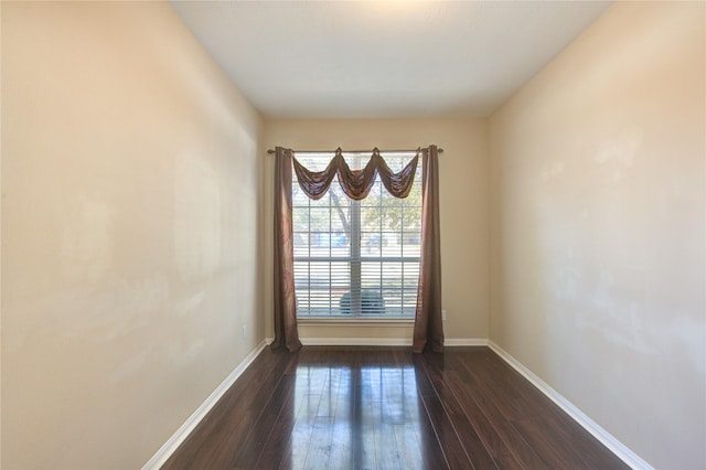 unfurnished room featuring dark hardwood / wood-style floors