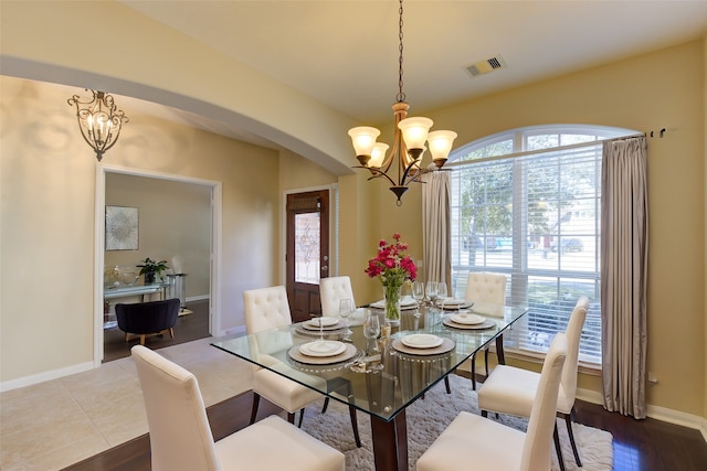 dining space with a chandelier