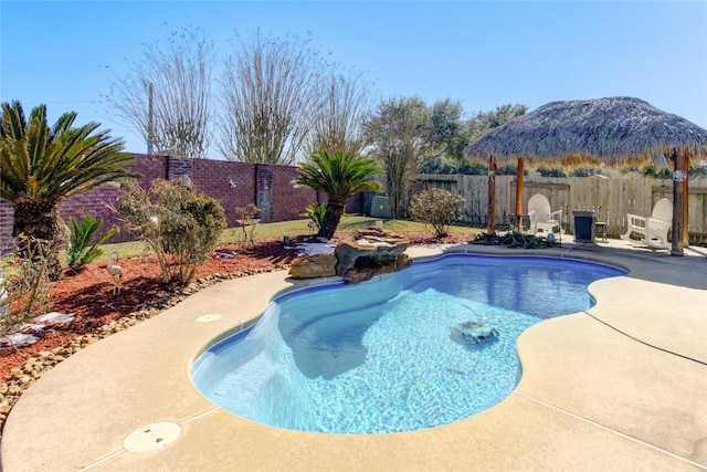 view of swimming pool with a patio area, a fenced backyard, and a fenced in pool