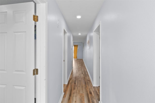 corridor featuring dark hardwood / wood-style floors