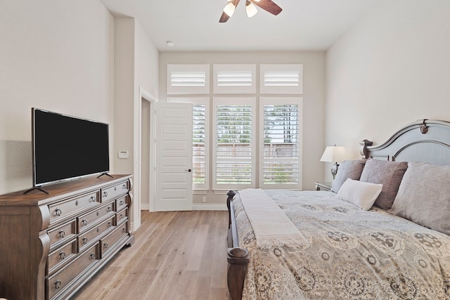 bedroom with ceiling fan and light hardwood / wood-style flooring