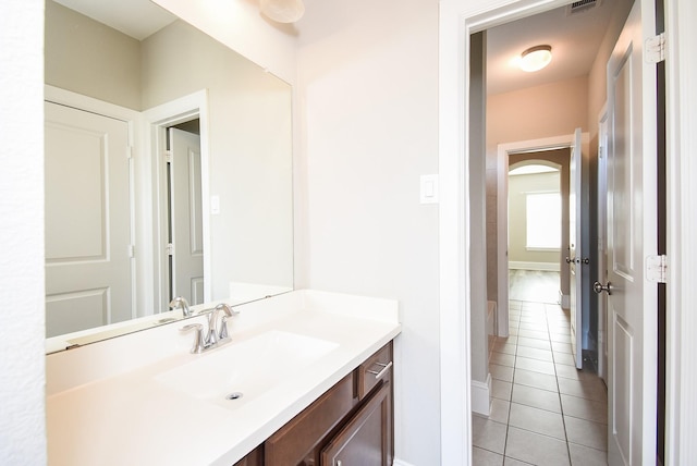 bathroom featuring tile patterned flooring and vanity