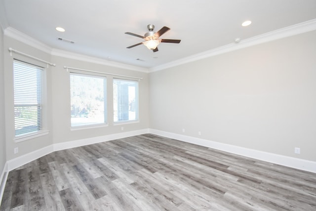 unfurnished room with ornamental molding, ceiling fan, and light hardwood / wood-style flooring