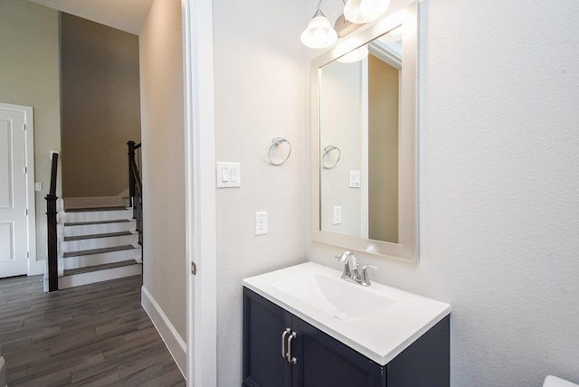 bathroom with hardwood / wood-style flooring and vanity