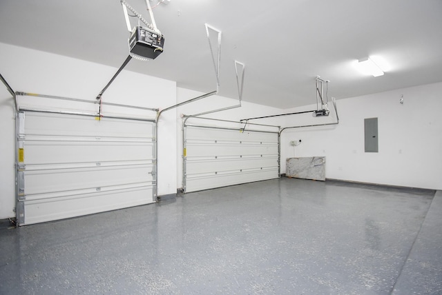 garage with a garage door opener and electric panel