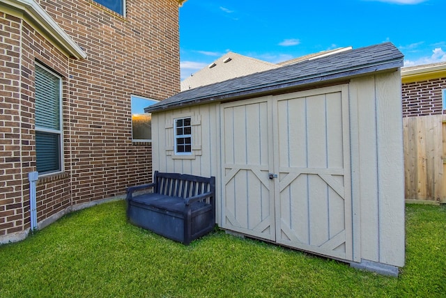 view of outdoor structure featuring a yard