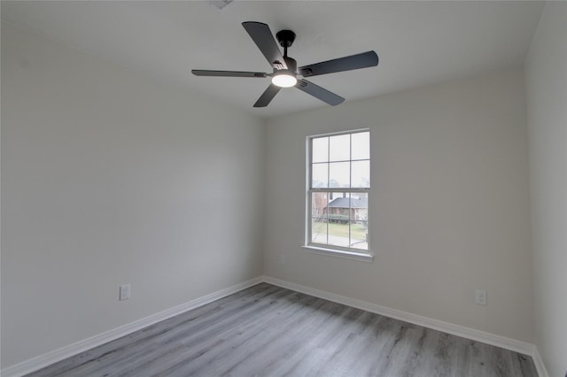 spare room featuring ceiling fan and light hardwood / wood-style floors