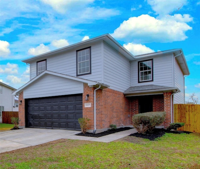 front of property featuring a garage and a front lawn