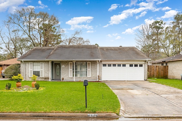 single story home featuring a garage and a front yard