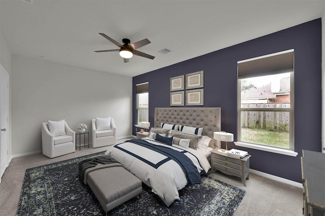 bedroom with ceiling fan and carpet