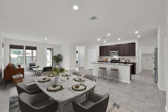 tiled dining space with sink