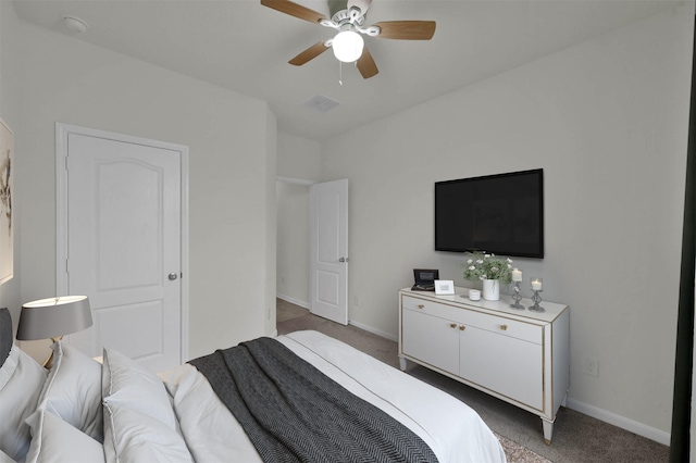 bedroom featuring ceiling fan and dark colored carpet