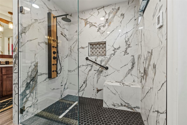 bathroom with tiled shower