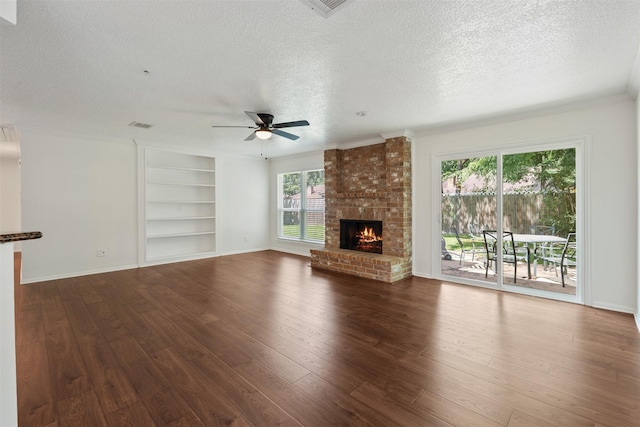 unfurnished living room with ceiling fan, a fireplace, and hardwood / wood-style floors