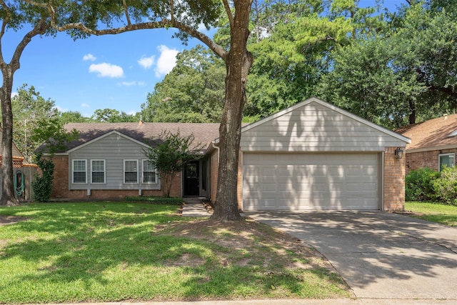 ranch-style home featuring a garage and a front lawn