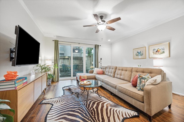 living room featuring crown molding, dark wood-type flooring, and ceiling fan