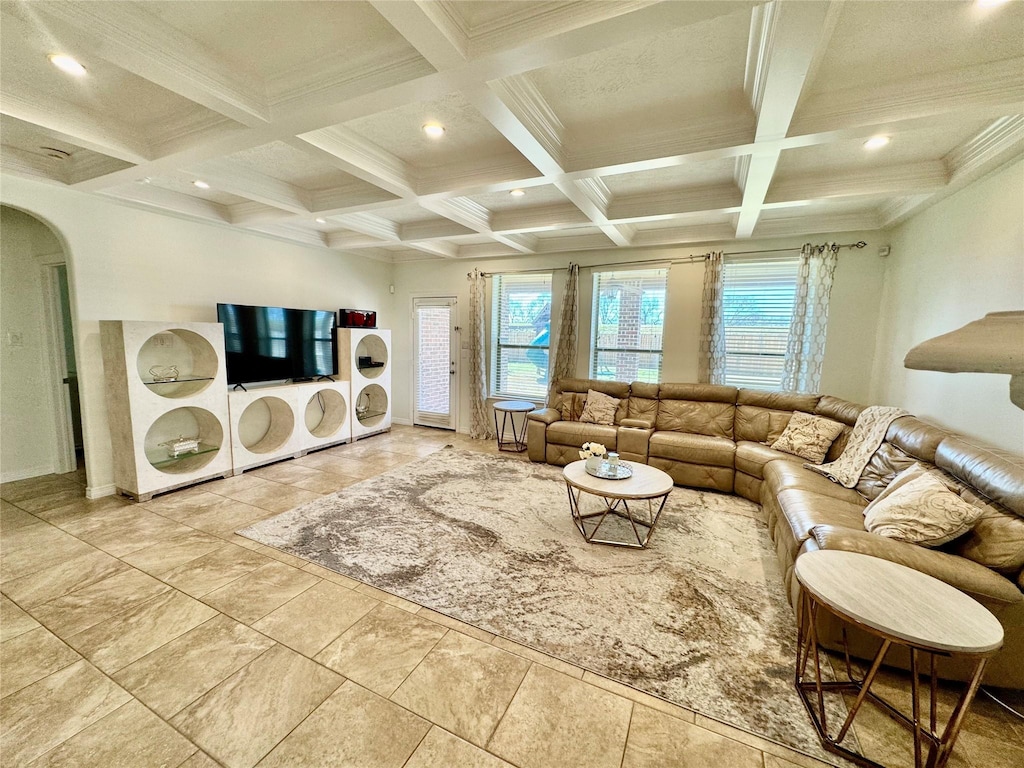 living room featuring coffered ceiling, ornamental molding, and beam ceiling