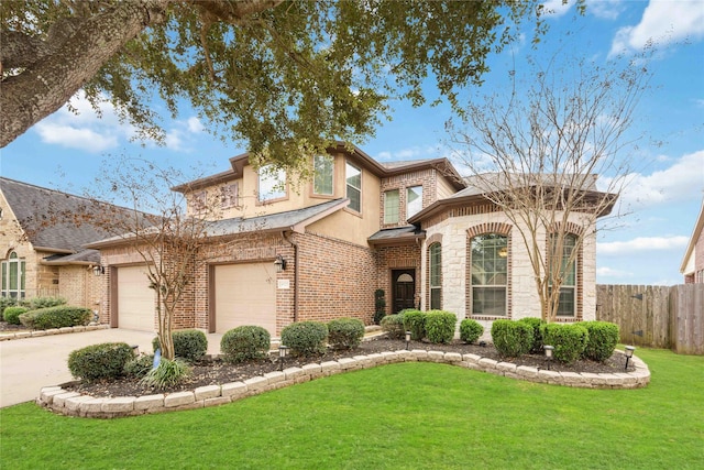 view of front of home featuring a garage and a front yard