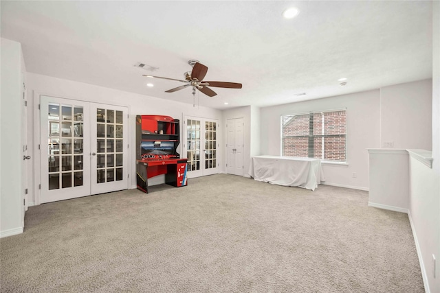 carpeted empty room featuring baseboards, french doors, visible vents, and recessed lighting