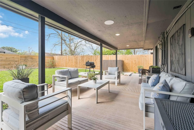 wooden deck featuring a yard and an outdoor hangout area