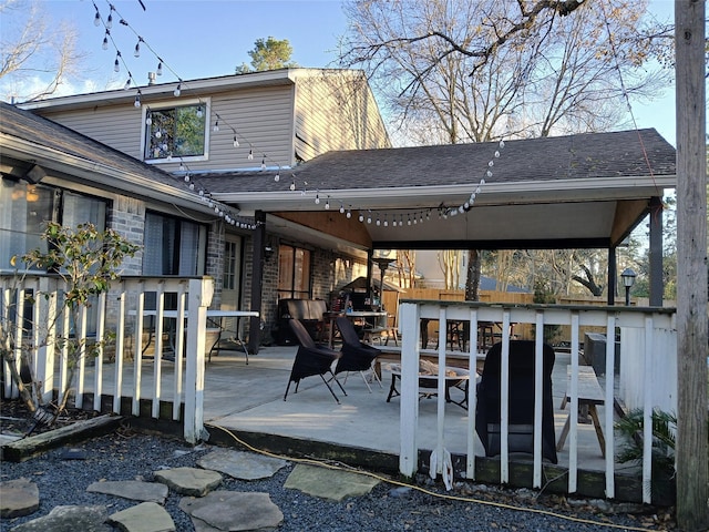 rear view of property with a patio area