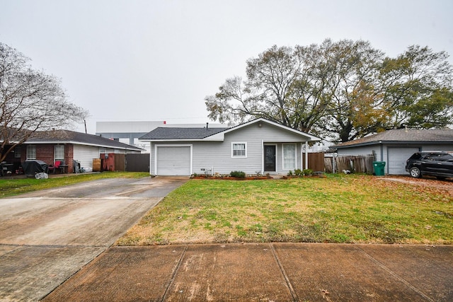 single story home featuring a garage and a front yard