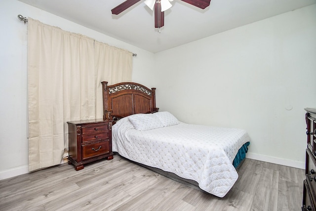 bedroom featuring ceiling fan and light wood-type flooring