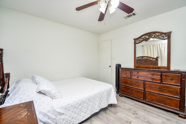 bedroom featuring ceiling fan and light wood-type flooring