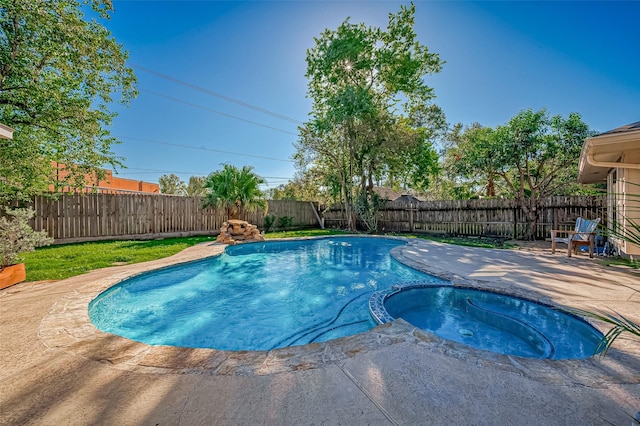 view of pool featuring an in ground hot tub and a patio